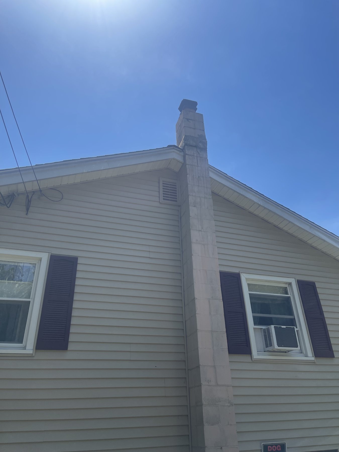 Before view of the original wood stove chimney