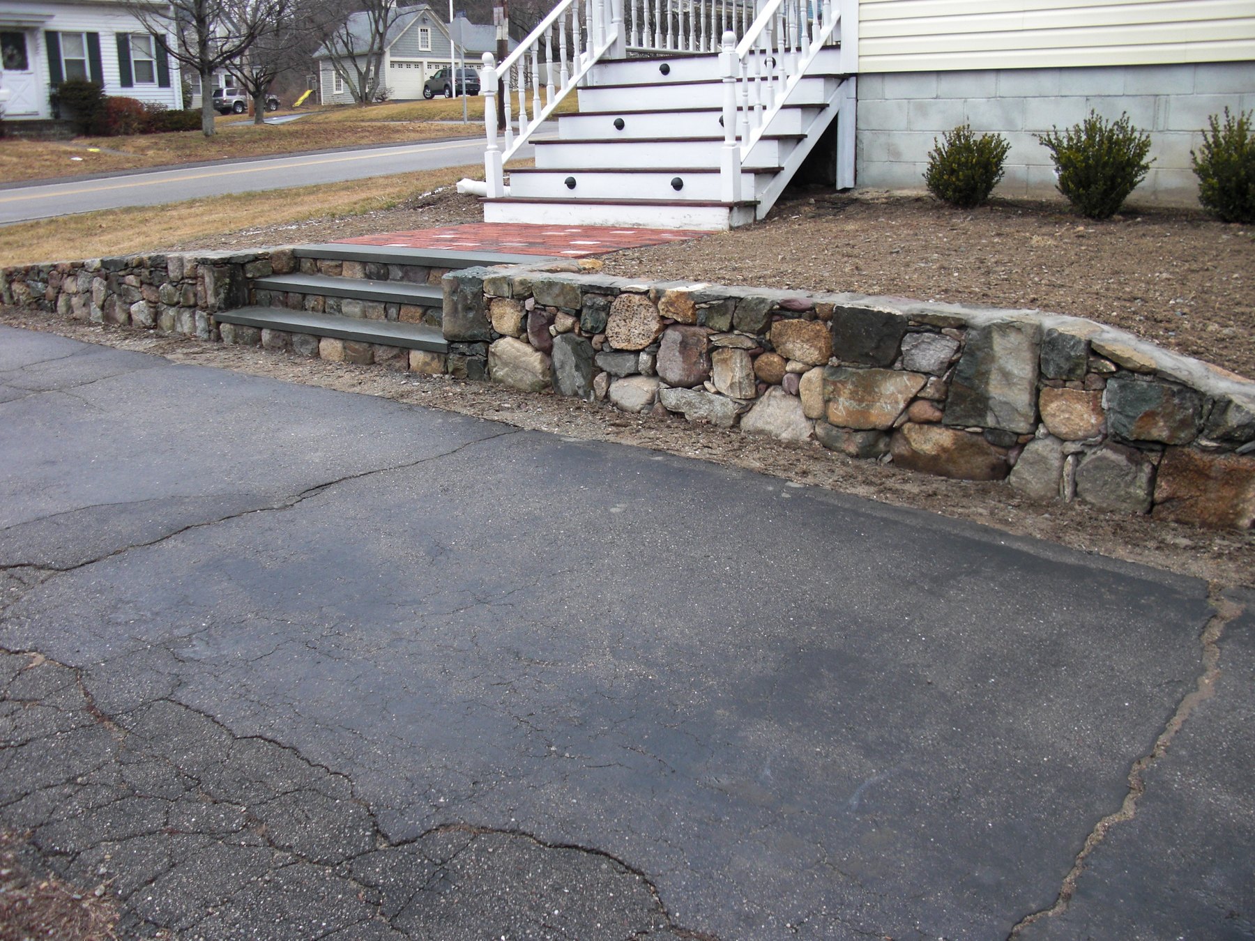Stone wall with bluestone-capped steps in Plainville, MA